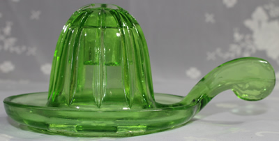 Side view of a Easy Squeeze green glass juicer fitting