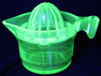 The no measurements U.S.Glass Co. Handy Andy Green glass juicer under UV light