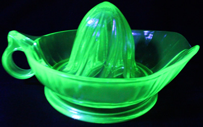 Green loop handle Jeannette Glass juicer under UV light