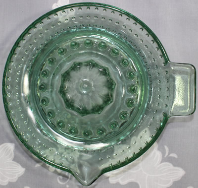 Top view of a hobnail bottle green glass saucer shape juicer