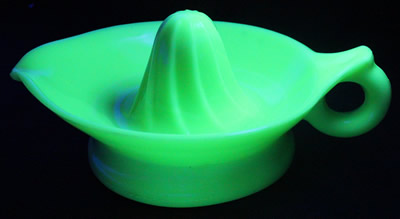 Jadeite McKee Glass juicer under UV light