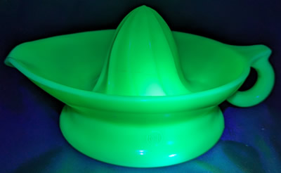 6" McKee jadedite juicer under UV light