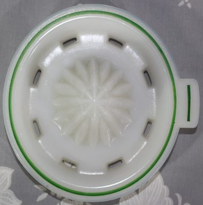 Reamer for a Hazel Atlas white milk glass with Green band juicer jug