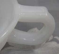 Handle of white milk glass Anchor Hocking Glass Co. juicer