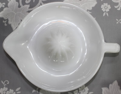 Top view of a white milk glass Anchor Hocking Glass Co. juicer