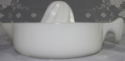 Side view of U.S.Glass Company white milk glass juicer