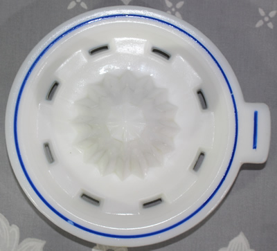 Reamer for a Hazel Atlas white milk glass with blue band juicer jug