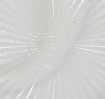 "B" in a circle on the base of a white milk glass glass Edna Barnes 2 piece reproduction juicer