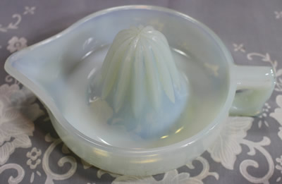 Showing the mid opalescence white glass SUNKIST juicer