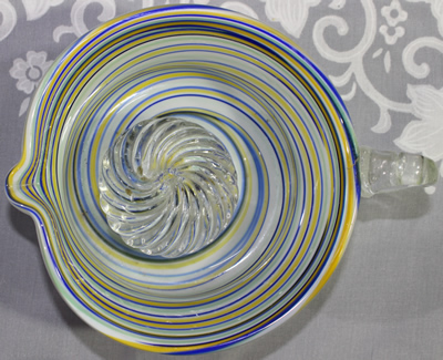 Top view of a multicoloured sprials on a handmade glass juicer