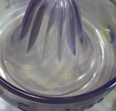The spiral in the colour of a straight handle purple glass Sunkist juicer