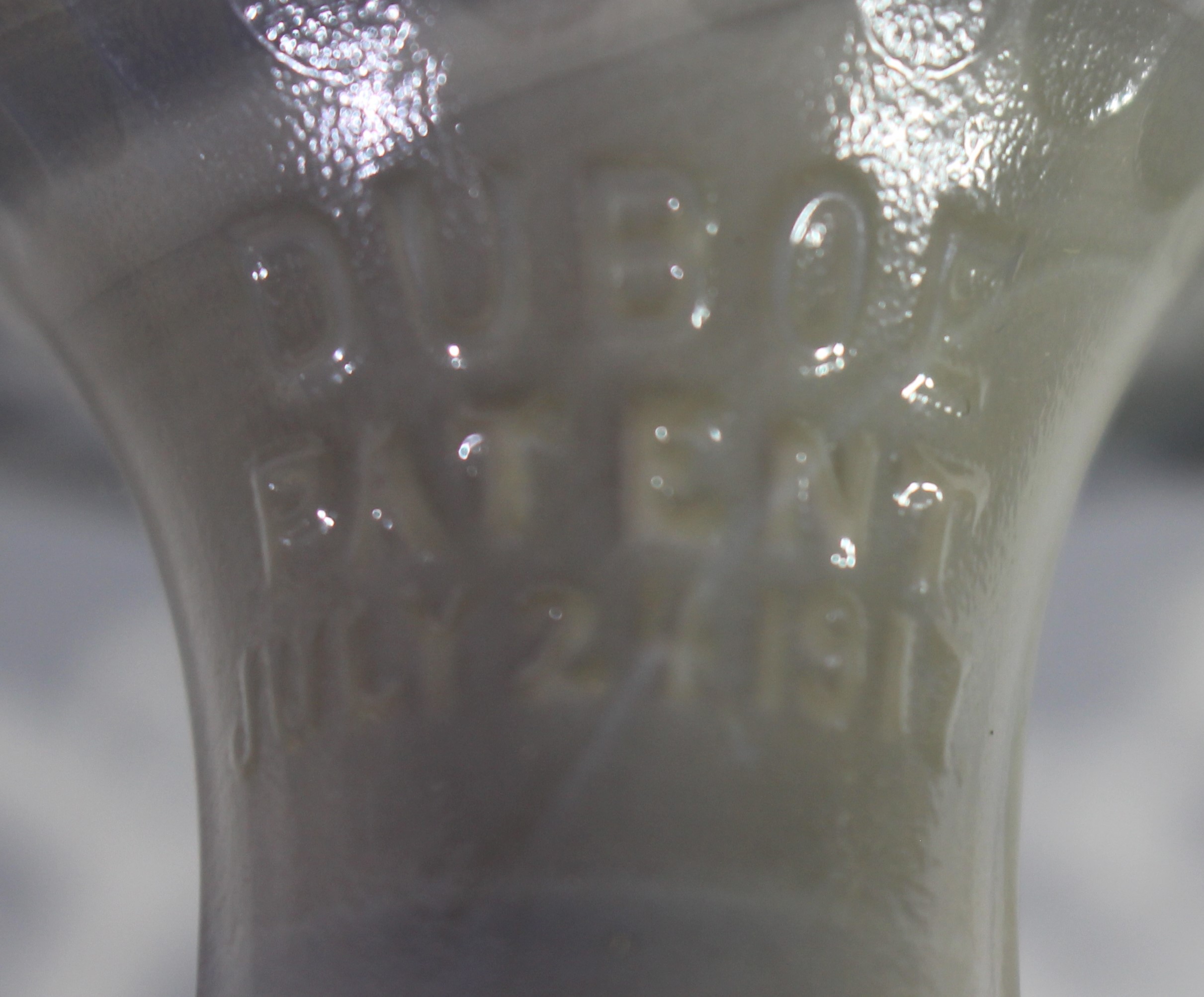 The embossed details on a grey marble reproduction of Duboe Patent reamer