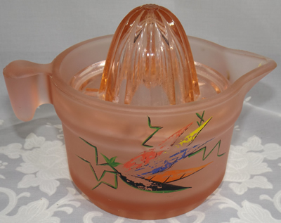 Pink satin U.S. Glass Company juicer showing crickets