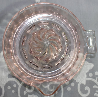 Top view of a pale pink Hazel Atlas panelled juicer