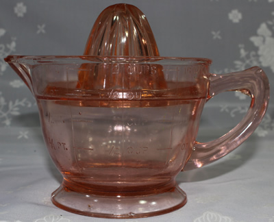 Side view of pink US Glass Company 2 piece juicer