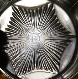 The 'B' in a circle for a frosted trim yellow Edna Barnes cup juicer