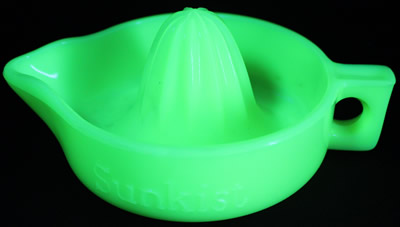 Seveille yellow Sunkist juicer under UV light
