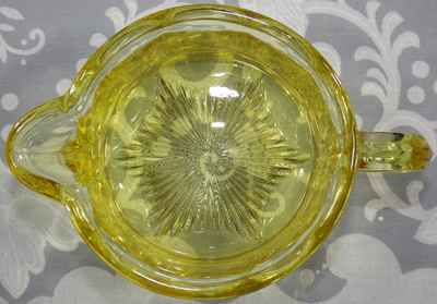 The base of the cup for a frosted gold glass Edna Barnes 2 piece juicer