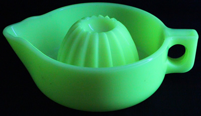 Seville yellow McKee Glass Co. juicer under UV light
