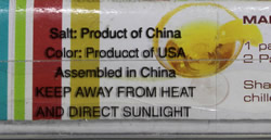 The labeling on a 'Margarita Set' with a yellow and clear glass saucer shape juicer