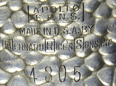 The hallmarks on an Apollo hammered silver plate juicer