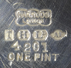 The hallmark on a hammered Harrods silver plate cocktail shaker with juicer including the One pint stamp
