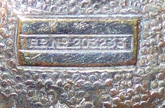 Registered design number on a Hukin & Heath silver plate screw juicer 