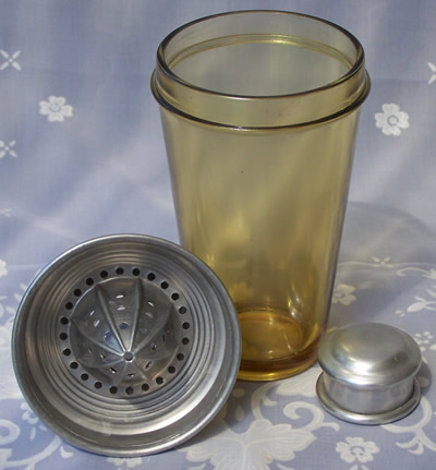 3 parts of an amber Paden City cocktail shaker with juicer