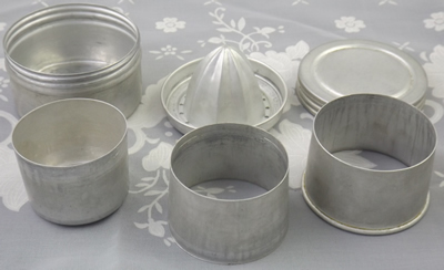 The parts of an aluminium collapsible cup with juicer