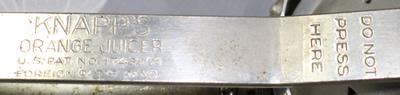 Name tag on KNAPP's ORANGE JUICER aluminium juicer with crank handle