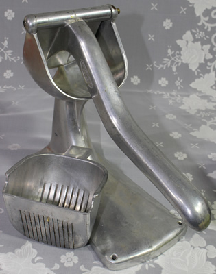 The 2 parts of a Simplex-Super large bench aluminum lever juicer