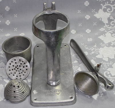 The parts of a Middle Eastern aluminium lever juicer