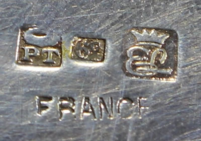 The hallmarks on a French 3 piece glass reamer on a silverplate saucer juicer