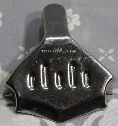 The back of a Japanese 70 mm stainless steel wedge squeezer