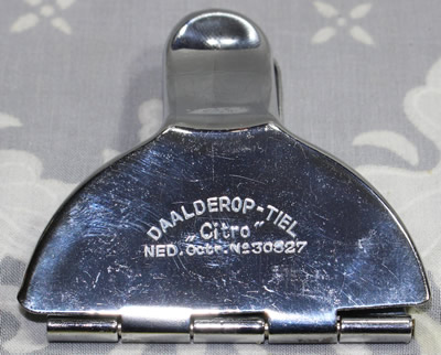 Back view of a Daalderop chrome lemon wedge squeezer