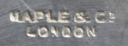 The hallmark on a Maple & Co. silverplate and glass juicer