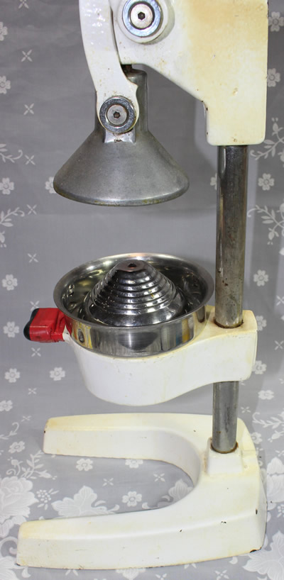 Front view of a yellow Japanese ceramic strainer juicer
