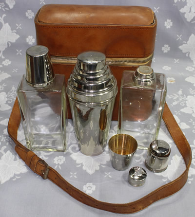 The set with a German 3 piece chrome plated cocktail shaker set with a juicer