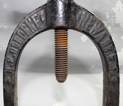 The embossing on a H F Osborne screw meat juice press