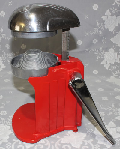The parts of a lever iron red Juice-O-Mat squeezer juicer