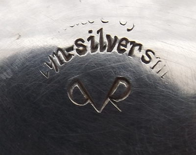 The hallmark on a strainer silver plate juicer with removable reamer