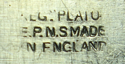 Hallmark on an English silver plate wedge juicer 