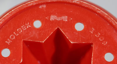 The branding a red plastic Moldex Australia juicer on clear base 