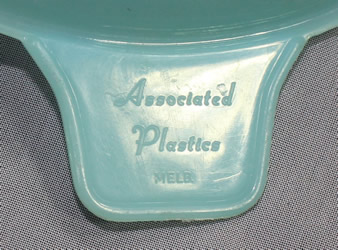 Embossed brand on a translucent pale blue plastic Associated Plastics juicer 