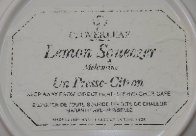 Paper label on base of Cloverleaf peaches melamine juicer