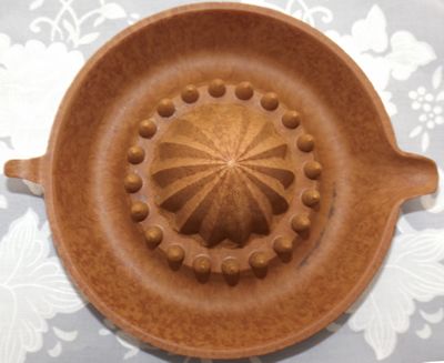 Brown/tan mottled Bakelite juicer top view