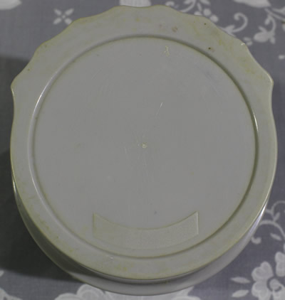 Base of a red and grey 3 pieces plastic juicer