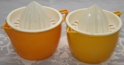 Orange and light orange and white plastic 2 piece juicer