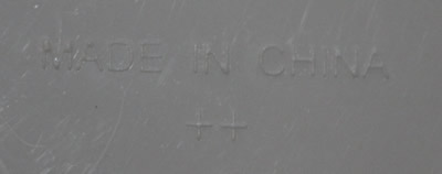 Embossed base of a white & green juicer