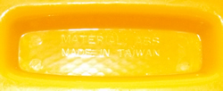 The embossed base on a 2 cone yellow plastic juicer with heart shape handle